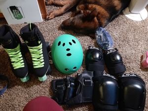 Size 9 women's roller skates and protective gear